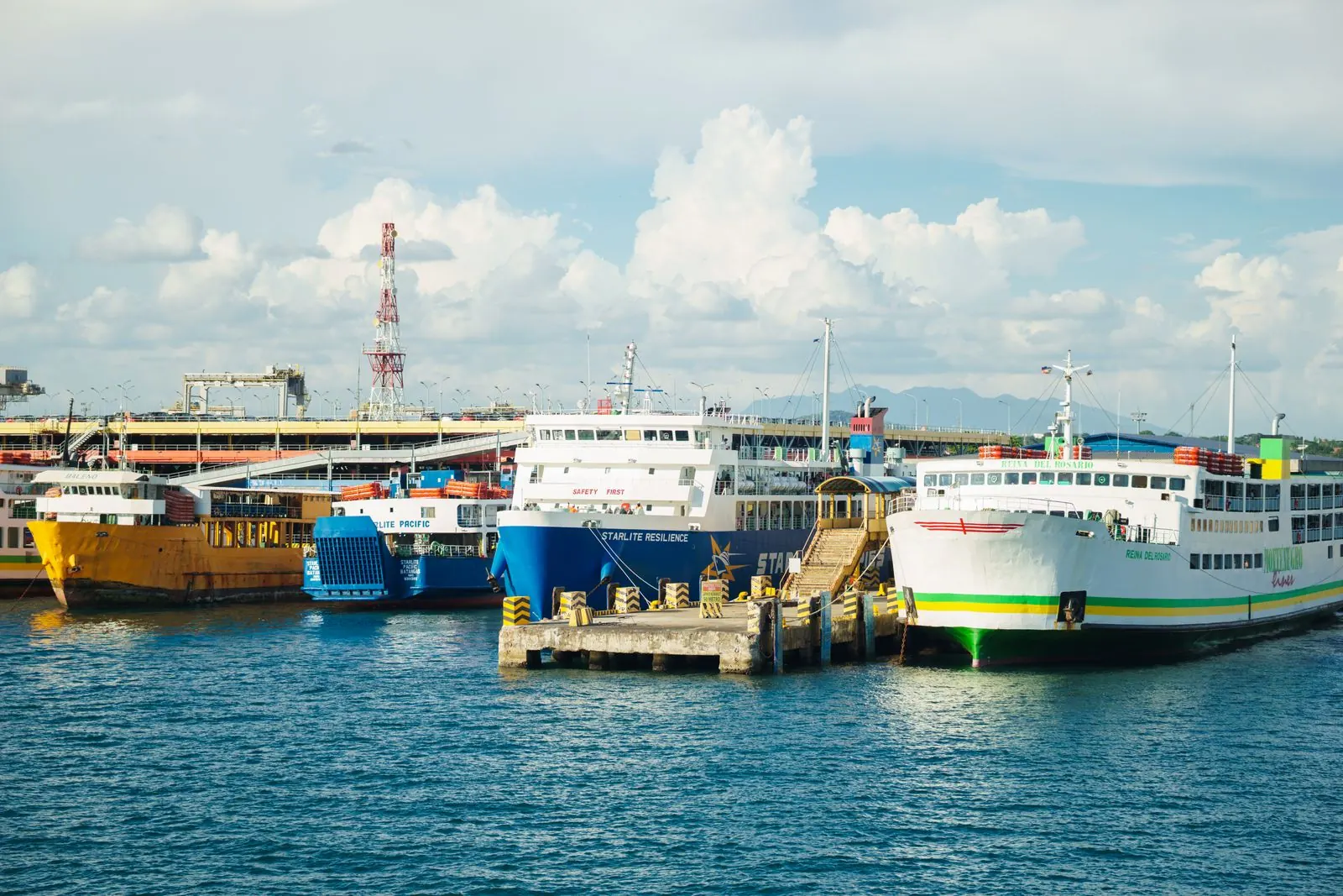 Photo: Nothing Ahead (Pexels License) Passenger ferries moored alongside a port quay under a bright blue sky